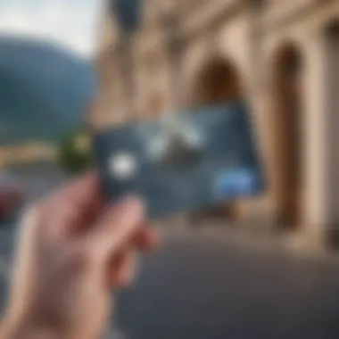 A hand holding a Hilton credit card against a scenic travel backdrop