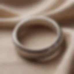 A close-up of a wedding ring resting on a soft fabric, symbolizing lost sentiment.