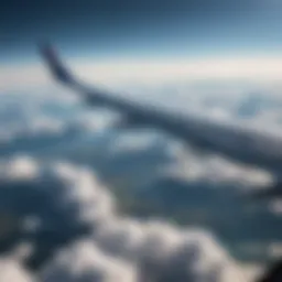 A scenic view from an airplane window, showcasing clouds and blue sky.