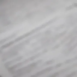 A close-up of health insurance tax forms laid out on a desk.