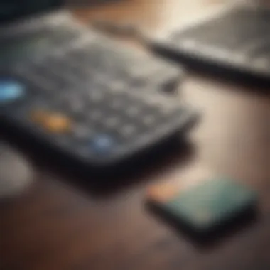 Close-up of a bank card and calculator on a table