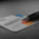 Close-up view of a credit card application form with a pen